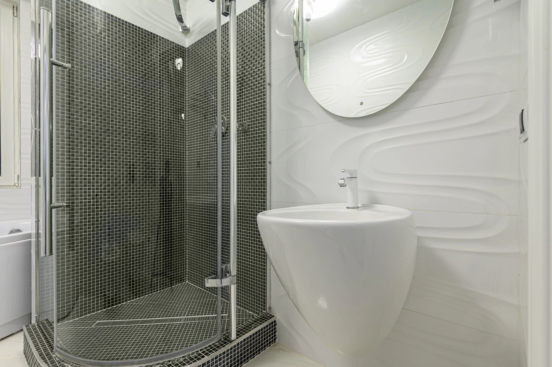 Bright modern bathroom with vanity and walk-in shower
