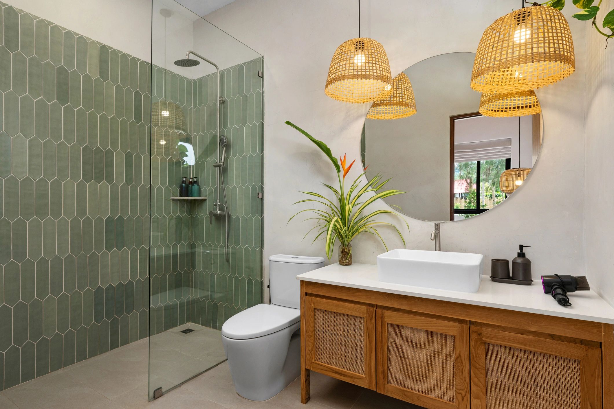 Modern bathroom with walk-in shower, wood vanity, and round mirror