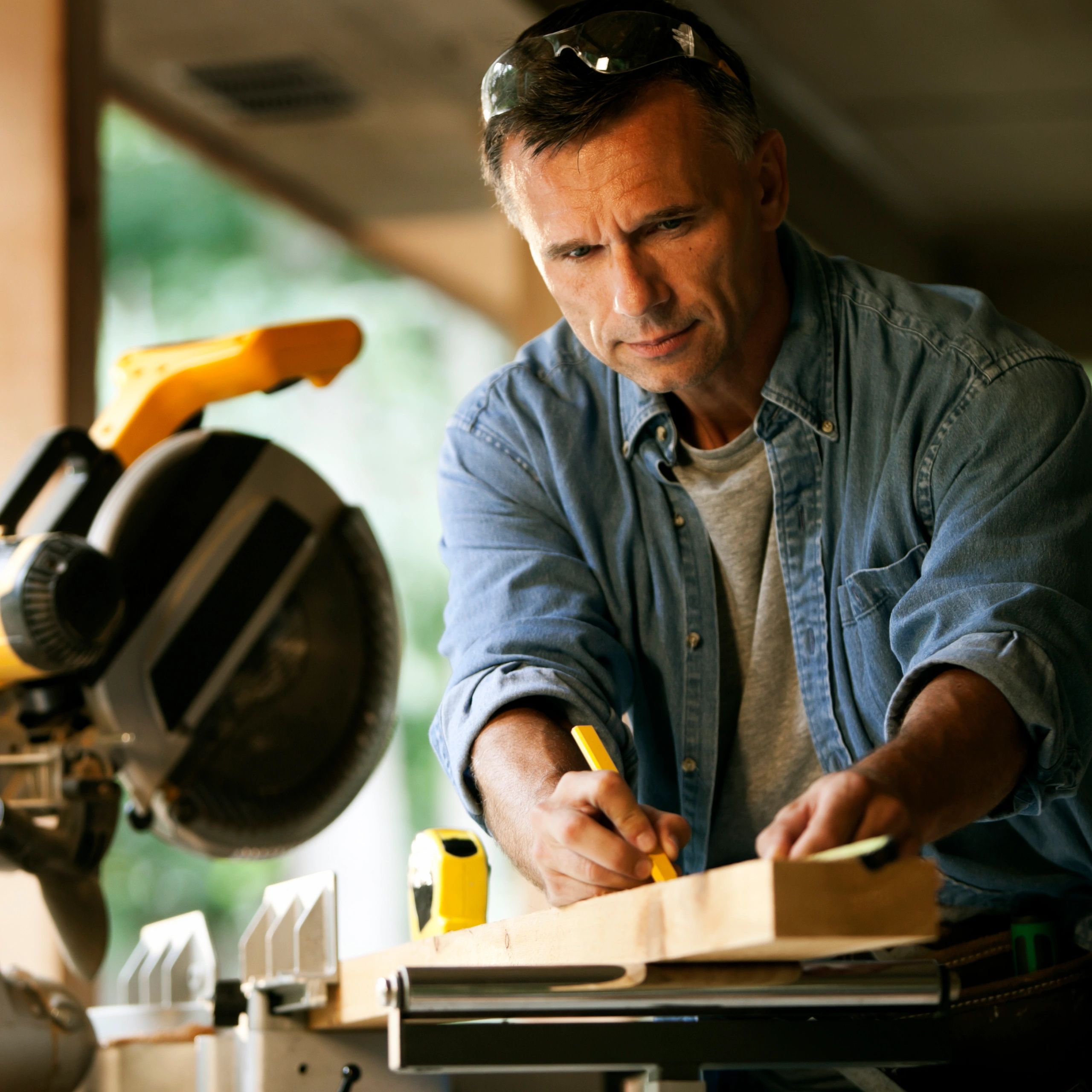 Contractor measuring materials on a job site